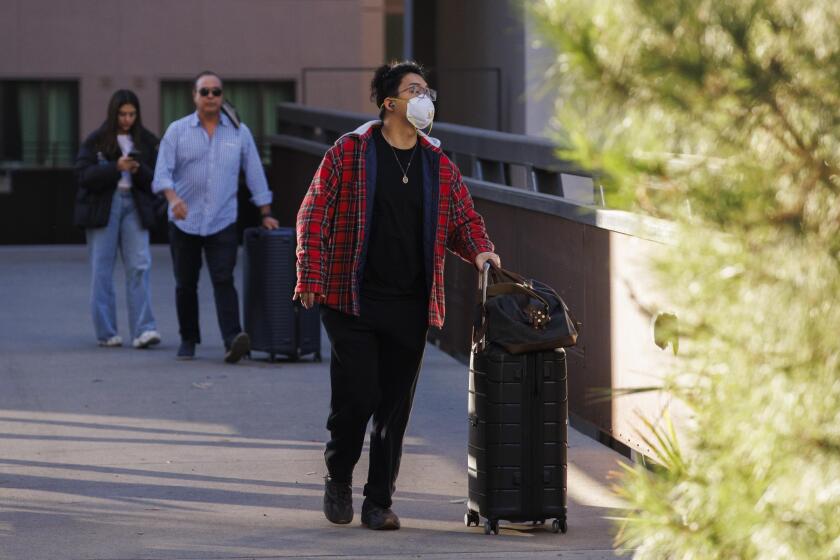 Los Angeles, CA - January 12: UCLA senior Elliott Cho moves out of the dormitory due to poor air quality caused by the Palisades Fire at UCLA on Sunday, Jan. 12, 2025 in Los Angeles, CA. "It's not safe to be here because of the air quality," says Cho. (Carlin Stiehl / For the Times)