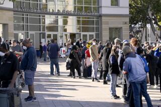 PASADENA, CA - JANUARY 12: People line up to fill out FIMA paperwork at the Pasadena Convention Center on Sunday, Jan. 12, 2025 in Pasadena, CA. (John McCoy / For The Times)