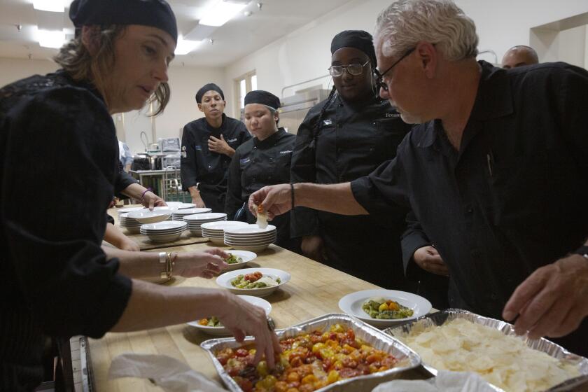 PASADENA, CALIF. - AUGUST 25, 2019: Twelve culinary students, who have experienced foster care, host a five-course meal for 50 guests with professional volunteer chefs on Sunday, Aug. 25, 2019 in Pasadena, Calif. It is the culmination of a culinary apprenticeship program launched by Hillsides, a Southern California foster care and mental health charity where the youth work with chefs and gain the knowledge and skills necessary to obtain employment in the culinary field. (Liz Moughon / Los Angeles Times)