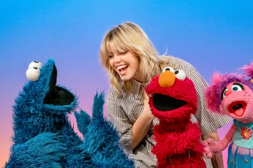 Renee Rapp with Cookie Monster, Elmo and Abby on "Sesame Street" Season 55.