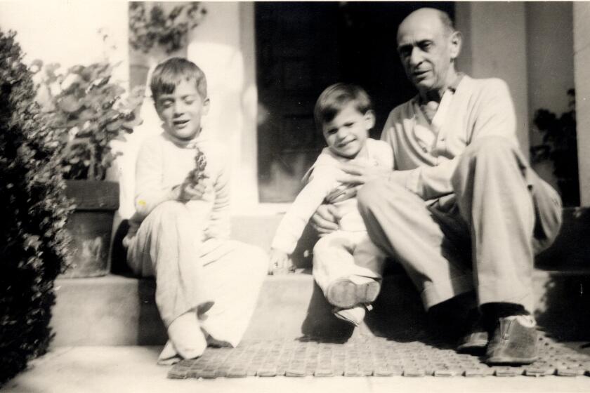 Composer Arnold Schoenberg in front of his Brentwood house with his two sons Ronald (lft dob 1937) and Larry (rt born 1941). (Belmont Music Publishers)