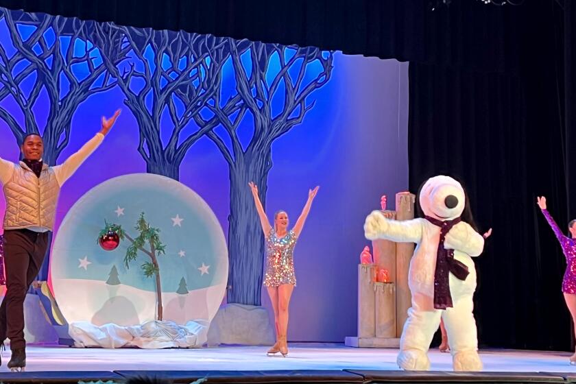 Snoopy waves alongside fellow ice skaters at the end of "It's Christmas, Snoopy!" produced by San Diego County-based All Wheel Sports. The ice skating-and-acrobat show is so popular with guests at California's Great America.