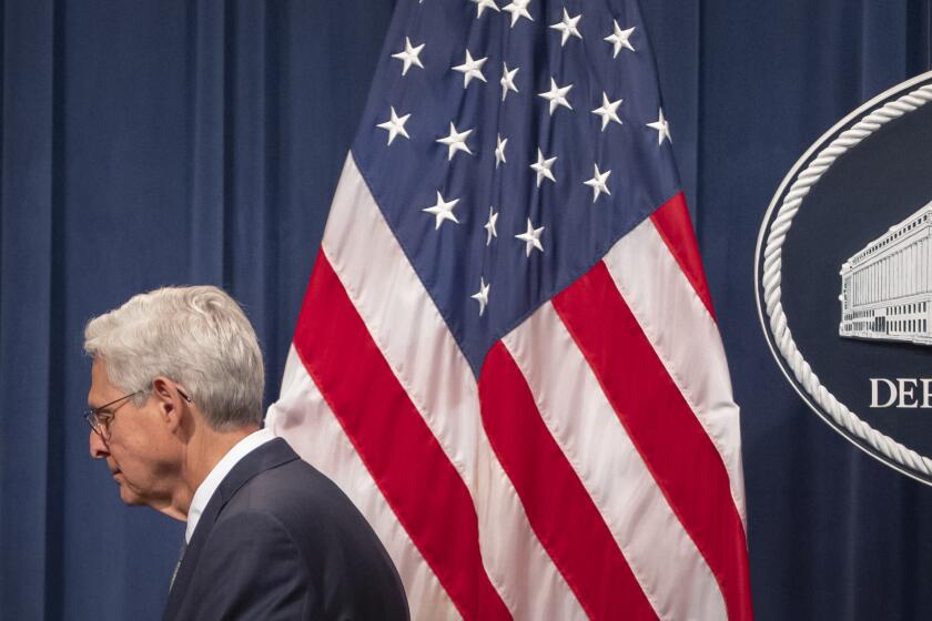 Attorney General Merrick Garland leaves after a news conference to announce that TD Bank will pay an approximately $3 billion settlement after authorities say the financial institution's lax practices allowed for significant money laundering, at the Department of Justice, Thursday, Oct. 10, 2024, in Washington. (AP Photo/Mark Schiefelbein)