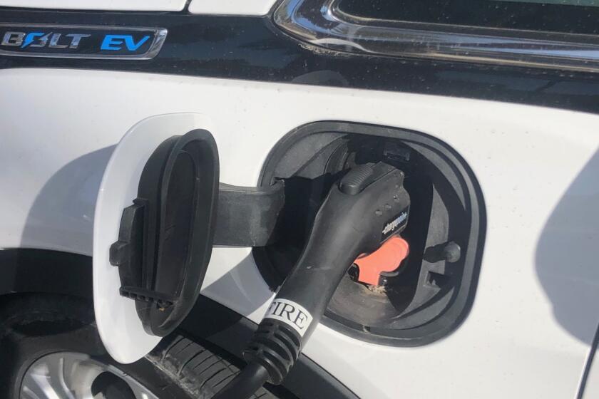 An electric vehicle at a charging station at Chula Vista City Hall in March 2021.