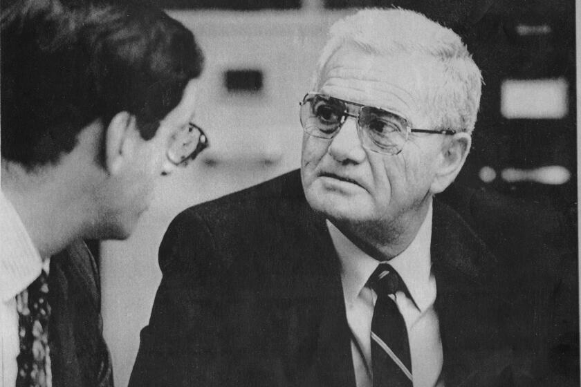 REDWOOD CITY, CALIFORNIA, November 4, 1990 -- George Franklin Sr. talks with his attorney Douglas Horngrad in a Redwood City, Calif. courtroom, in the 21-year-old slaying of his daughter's playmate in a trial triggered by his daughter's claim she suddenly recalled the murder. (AP LaserPhoto) (POOL/ Russell D. Curtis) Photo Credit: Associated Press