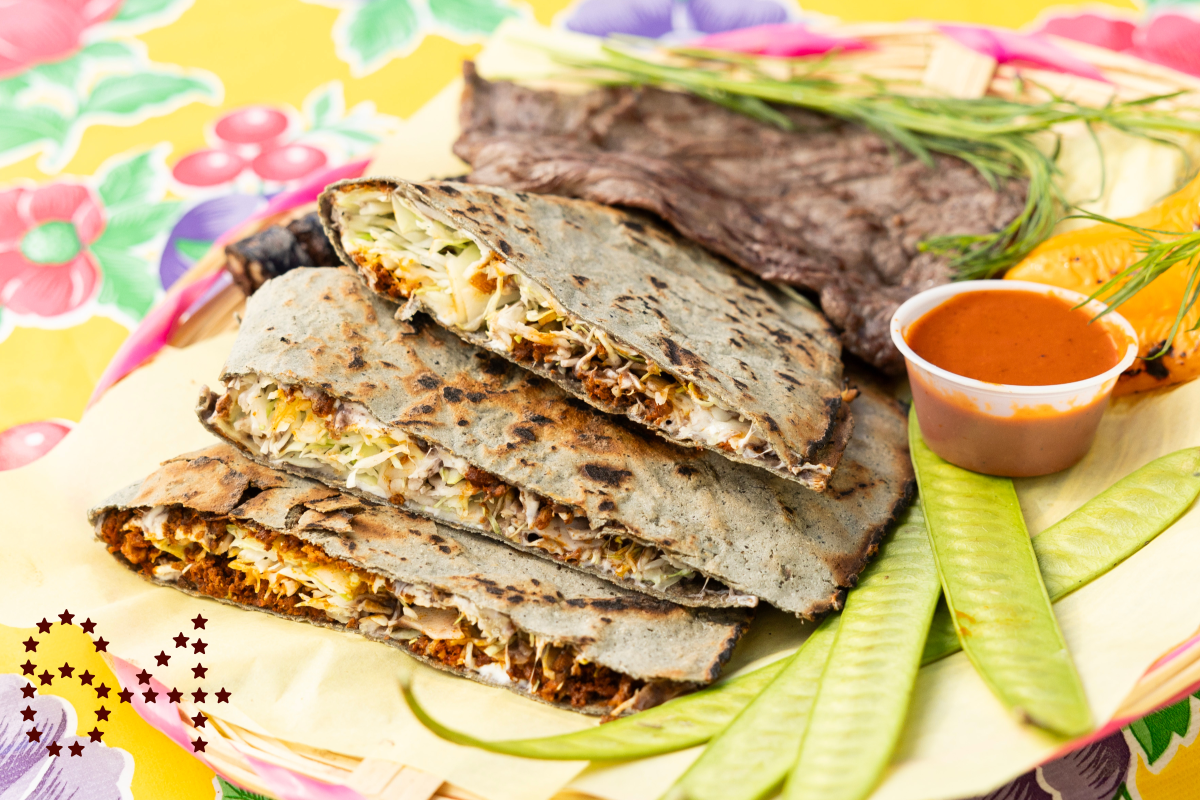 LOS ANGELES, CA - OCTOBER 25: Poncho's tlayuda with three meats - chorizo inside, asada and moronga (blood sausage) at Poncho's Tlayudas in Los Angeles, CA on Friday, Oct. 25, 2024. (Myung J. Chun / Los Angeles Times)