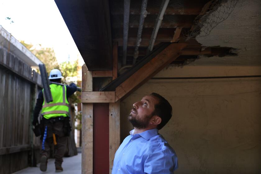 VENICE-CA-NOVEMBER 7, 2024: Narek Ekmekjyan, Vice President of Optimum Seismic, takes a look at the retrofit work done by the company at an apartment building in Venice on November 7, 2024. (Christina House / Los Angeles Times)