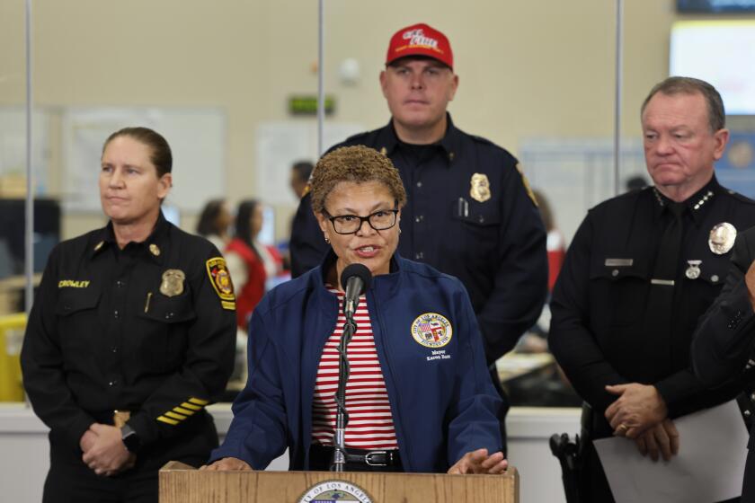 Los Angeles, California-Jan. 11, 2025-Los Angeles Mayor Karen Bass, Los Angeles Fire Chief Kristin Crowley, and Los Angeles Police Chief Jim McDonnell address the media at a press conference on Saturday, Jan. 11, 2025. (Allen J. Schaben/Los Angeles Times)