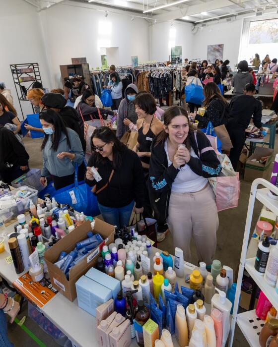 Los Angeles, CA - January 14: 14 year old Avery Colvert, not pictured, who started Altadena Girls to gather donations for teen girls who lost their homes in the Eaton fire, distributes items from a warehouse in LA. Teen girls and their families and some of the supplies they might be getting, whether it's cosmetics or hair supplies, etc. in Los Angeles Tuesday, Jan. 14, 2025. She launched the effort on Instagram on Friday Jan. 10 and it blew up, attracting support from a slew of celebrities. (Allen J. Schaben / Los Angeles Times)