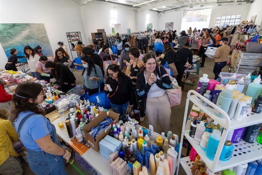 Los Angeles, CA - January 14: 14 year old Avery Colvert, not pictured, who started Altadena Girls to gather donations for teen girls who lost their homes in the Eaton fire, distributes items from a warehouse in LA. Teen girls and their families and some of the supplies they might be getting, whether it's cosmetics or hair supplies, etc. in Los Angeles Tuesday, Jan. 14, 2025. She launched the effort on Instagram on Friday Jan. 10 and it blew up, attracting support from a slew of celebrities. (Allen J. Schaben / Los Angeles Times)