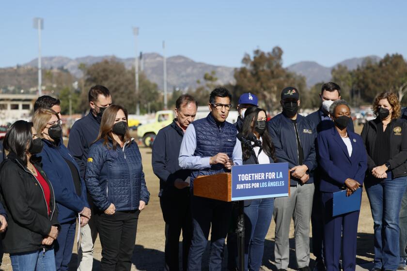 Pasadena, CA - January 16: Speaker Robert Rivas, center, speaks, and joined by the Los Angeles Assembly Delegation, and Members from across California during a legislative update, including plans to expedite and support Southern California firestorm response and recovery near the Rose Bowl in Pasadena Thursday, Jan. 16, 2025. (Allen J. Schaben / Los Angeles Times)