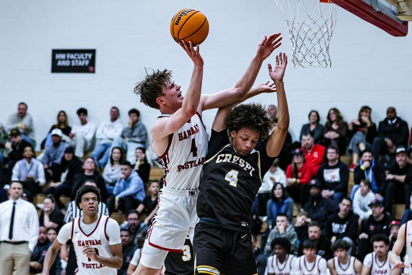 Nikolas Khamenia of Harvard-Westlake goes up over Crespi's Kingston Smith.