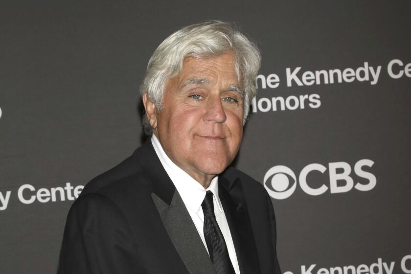 Jay Leno poses in a black suit at the Kennedy Center Honors on Dec. 3, 2023, at The Kennedy Center in Washington