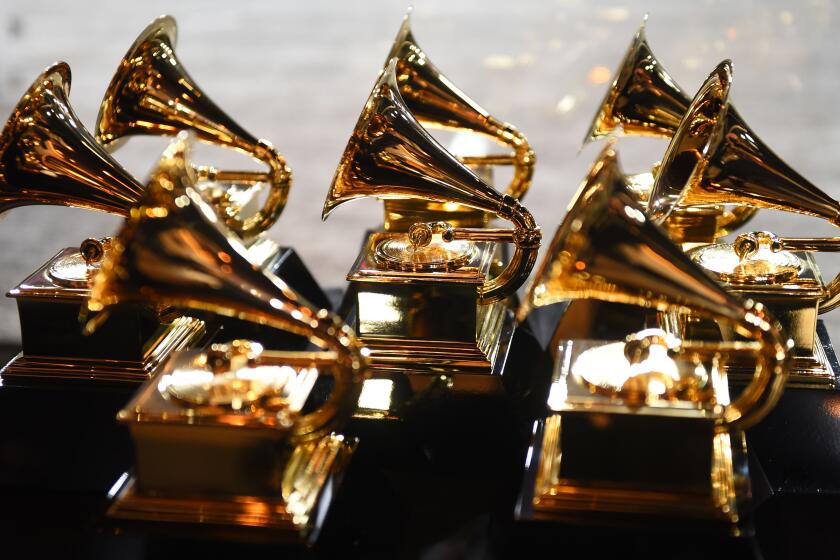 Grammy trophies sit in the press room 