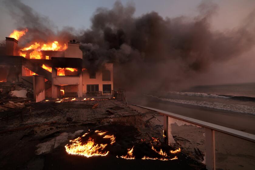 Malibu, California January 8, 2025-A house burns along PCH as the Palisades Fire burns in Malibu Wednesday. (Wally Skalij/Los Angeles Times)