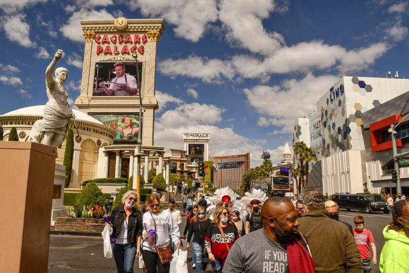 On the Las Vegas Strip, foot traffic is up as pandemic restrictions loosen and spring events lure travelers back.