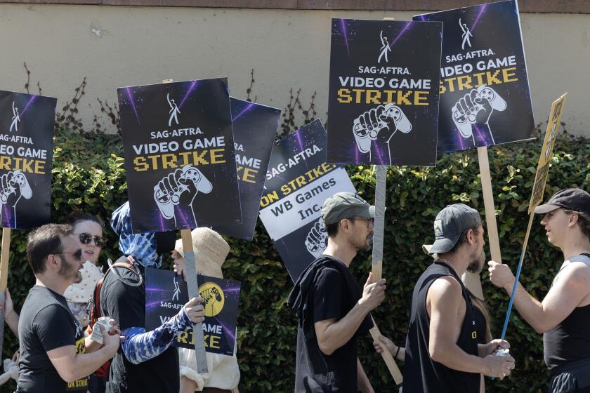 BURBANK, CA - AUGUST 01: Video game actors, with many non-video game SAG-AFTRA supporters, walked the picket line at Warner Bros. Studio in Burbank on Thursday, Aug. 1, 2024. (Myung J. Chun / Los Angeles Times)