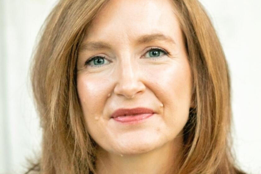 Portrait of redheaded woman smiling at camera