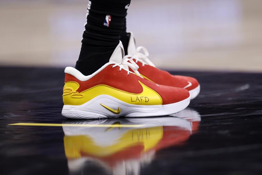 Lakers forward LeBron James' shoes honor the Los Angeles Fire Department  during a game against the Spurs