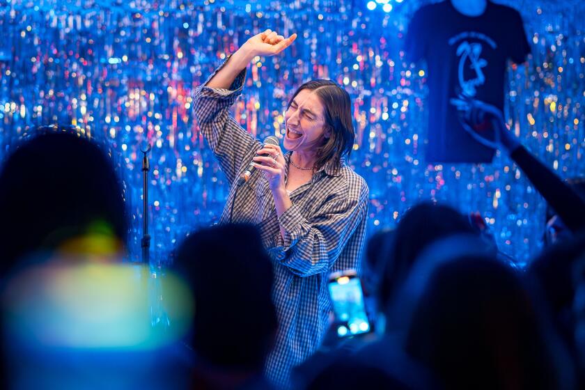 LOS ANGELES, CA - Dec. 19, 2024: Sloan sings Brandi Carlile's "The Joke" at Karaoke Country Revue at Permanent Records Roadhouse. (Michael Owen Baker / For The Times)