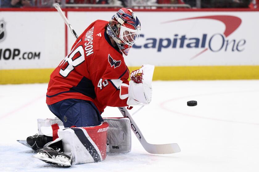 Washington Capitals goaltender Logan Thompson wqtches the puck during the second period of an NHL hockey game against the Anaheim Ducks, Tuesday, Jan. 14, 2025, in Washington. (AP Photo/Nick Wass)