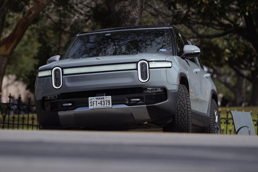 FILE - A Rivian sports-utility vehicle is seen on display in Austin, Texas, Feb. 22, 2023. Shares of Rivian are soaring before the opening bell on Wednesday, June 26, 2024, after Volkswagen has agreed to invest up to $5 billion in a new joint venture with the electric vehicle maker. (AP Photo/Eric Gay, File)