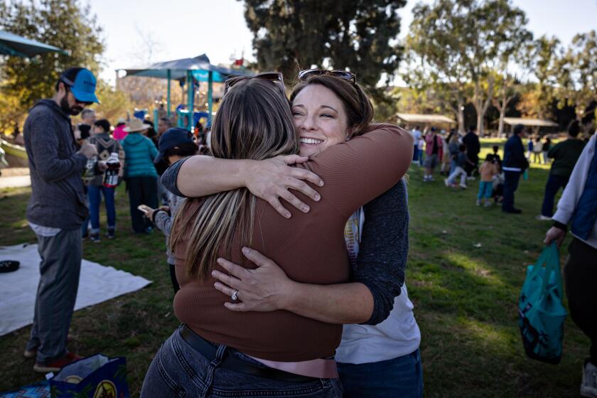 San Gabriel, CA - January 14: Bonnie Brimecombe the principal of Odyssey Charter School South, which burned down last week in the Eaton fire gathers with students, parents and teachers at Vincent Lugo Park in San Gabriel to try to have a relaxing day at the park in the face of a major tragedy on Tuesday, Jan. 14, 2025 in San Gabriel, CA. (Jason Armond / Los Angeles Times)