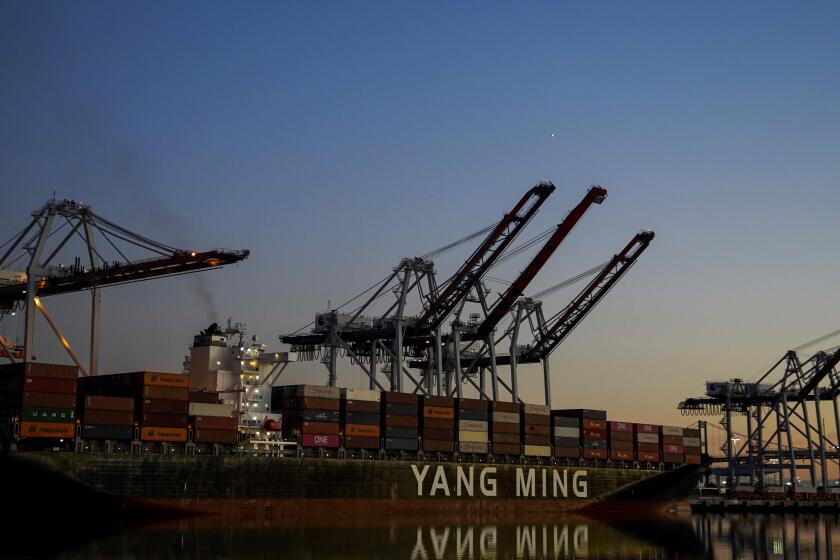 WILMINGTON, CALIF. - DECEMBER 18: The sun sets on the TraPac terminal at the Port of Los Angeles on Wednesday, Dec. 18, 2019 in Wilmington, Calif. (Kent Nishimura / Los Angeles Times)