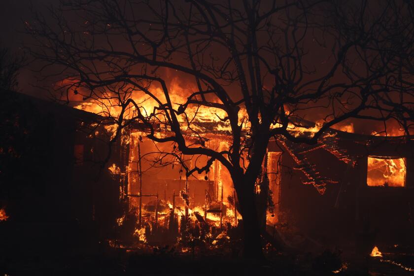 PACIFIC PALISADES, CALIF JANUARY 7, 2024 - A home is consumed by flames from the Palisades fire, which quickly consumed more than 1,200 acres on Tuesday, Jan. 7, pushed by gusting Santa Ana winds that were expected to continue for two more days. (Brian van der Brug / Los Angeles Times)