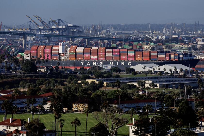 SAN PEDRO, CA - JUNE 25, 2024: A cargo ship leaves the Port of Los Angeles and heads out to sea on June 25, 2024 in San Pedro, California.(Gina Ferazzi / Los Angeles Times)