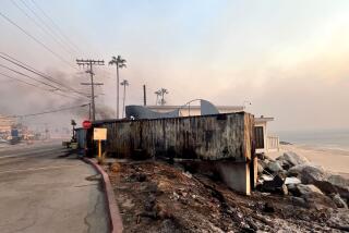 Gladstone's Malibu, an iconic dining landmark, pictured partially smoking from the Palisades Fire on Jan. 8, 2025.