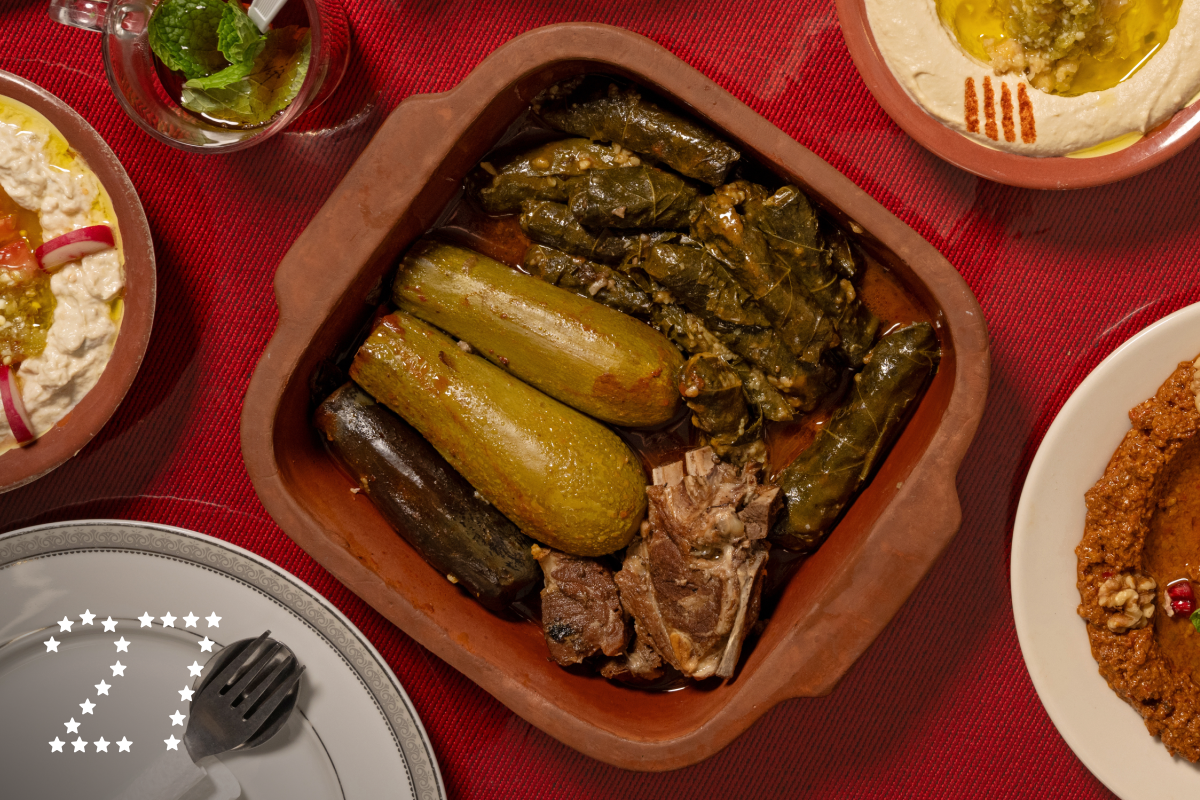 ANAHEIM, CA - OCTOBER 22, 2024: Spread of dishes including the Tuesday special: Kusa & Grape Leaves with Meat along with popular sides like hummus, muhamara, baba ghanouj, and tabbouli at Al Baraka in Anaheim (Ron De Angelis / For The Times)