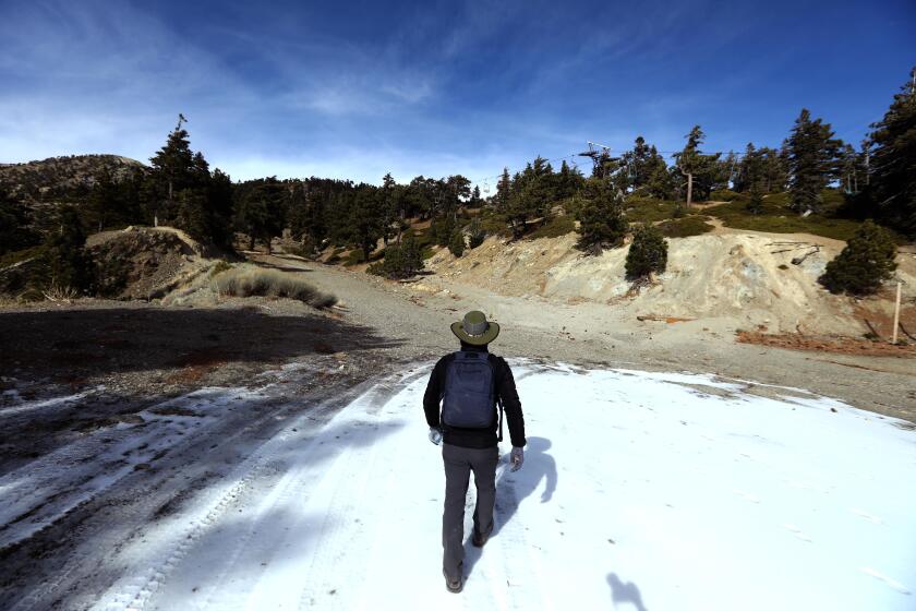 MOUNT BALDY, CA - DECEMBER 14, 2024 - - Roy Aguilar, from Claremont, heads to a hiking trail at the Mount Baldy Ski Resort on December 14, 2024. "I saw the signs coming up," said Aguilar about the hiking trails were closed. Mt Baldy is closed to hikers to let the vegetation and soil recover from the fire in September. The U.S. Forest service has closed the entire mountain, essentially, for more than a year, until December 2025. The ski area, which is in the middle of the closure area, is allowed to stay open. Lots of people are ignoring the closure order and risking a $5,000 fine, to hike anyway. (Genaro Molina/Los Angeles Times)