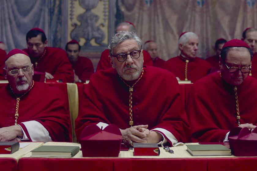 This image released by Focus Features shows Sergio Castellitto, center, in a scene from "Conclave." (Focus Features via AP)