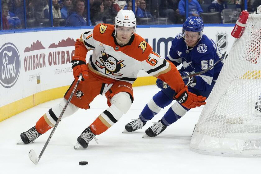 Anaheim Ducks left wing Cutter Gauthier (61) skates ahead of Tampa Bay Lightning center Jake Guentzel.