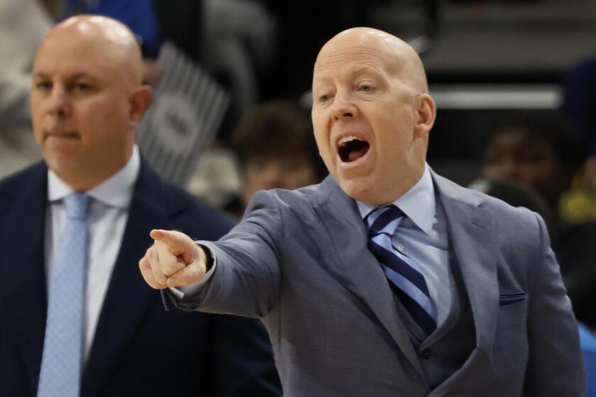 Inglewood, CA - December 28: UCLA had coach Mick Cronin, right, yells at a player.